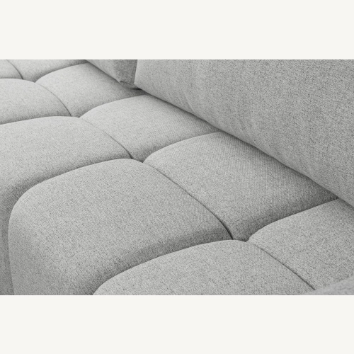 Fumo Komfortowa sofa narożna pikowana Tkanina Neve 83